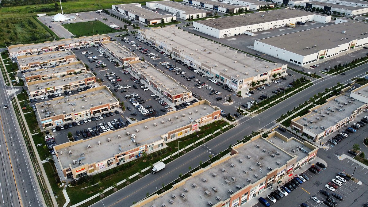 Aerial photograph of Ridgeway Plaza parking on Tuesday 11 August 2026 at 7:37 PM, showing open spaces in the rows across the cluster